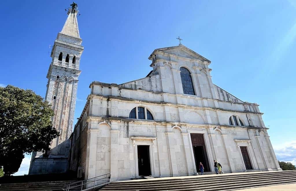 St. James Church in Trogir, Croatia, features stunning architecture and a tall bell tower, part of Adventour begins' cultural travel experiences.
